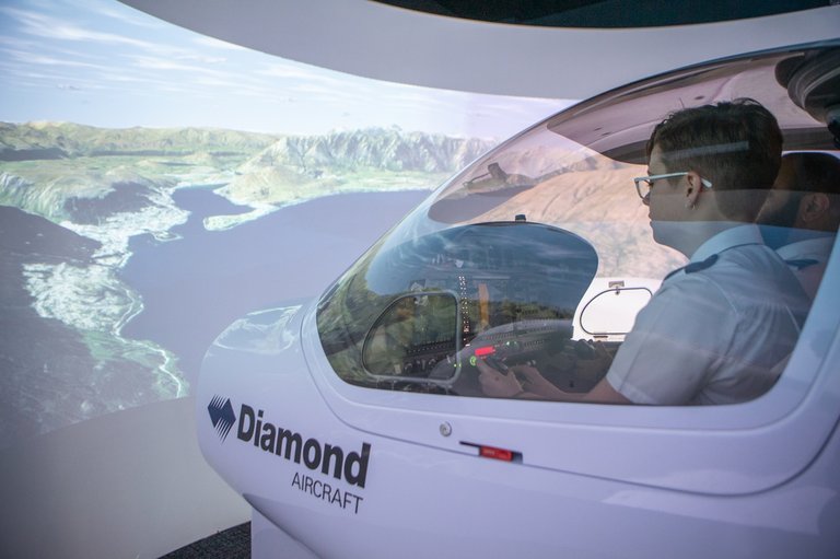 Aviation student using flight simulator