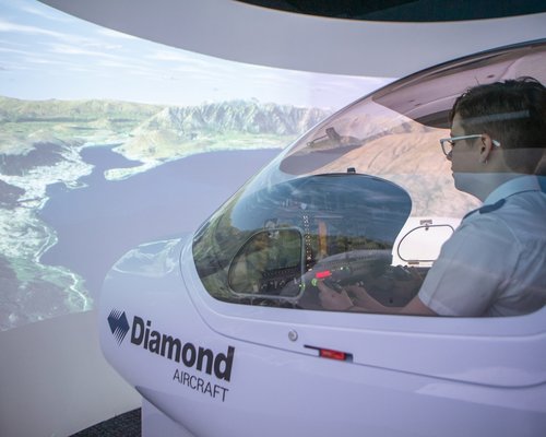 Aviation student using flight simulator