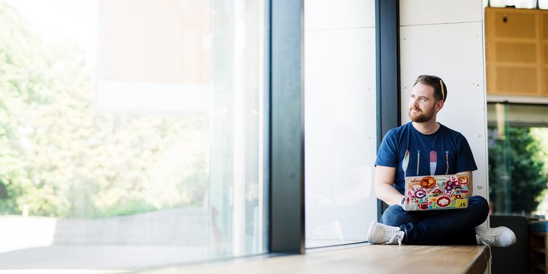Adult student studying on his laptop