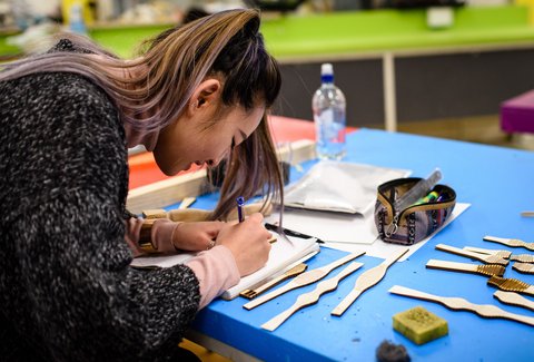 Student on campus in industrial design workshop