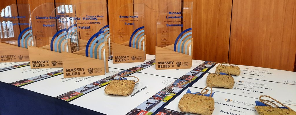 A collection of Massey Blues trophies on a table.