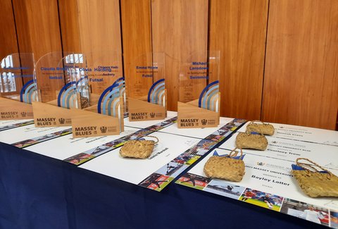 A collection of Massey Blues trophies on a table.