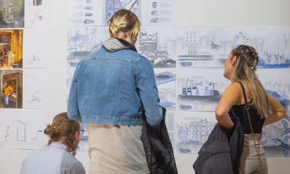 Students looking at spatial design concepts at exposure event at Massey University.