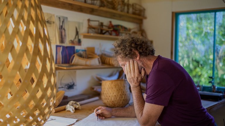 David Trubridge in his workshop working on a design.
