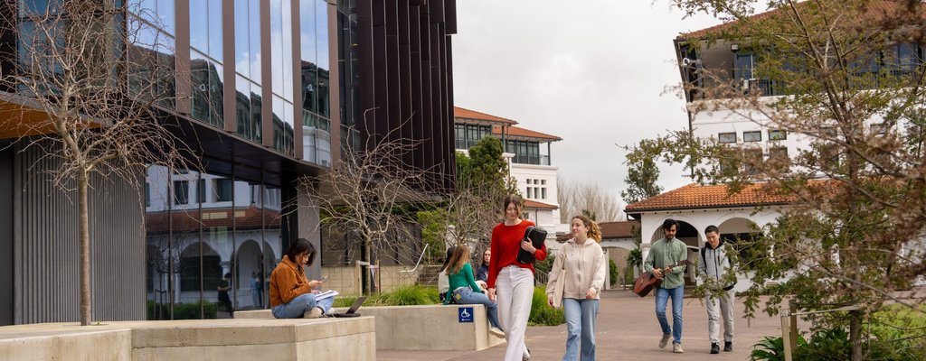 Students walking around Massey University campus