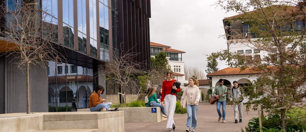 Students walking around Massey University campus
