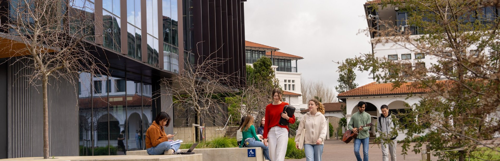 Students walking around Massey University campus
