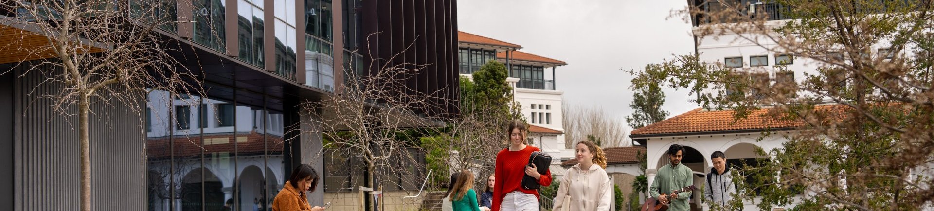 Students walking around Massey University campus