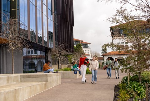 Students walking around Massey University campus