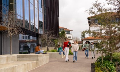 Students walking around Massey University campus