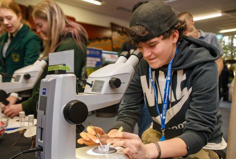 Palmerston North open day - person in science lab at Massey