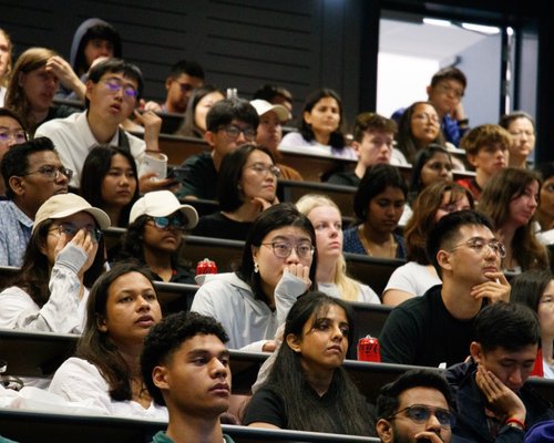Orientation on Auckland campus. Students in lecture theatre seated for presentation.