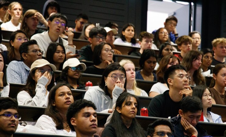 Orientation on Auckland campus. Students in lecture theatre seated for presentation.