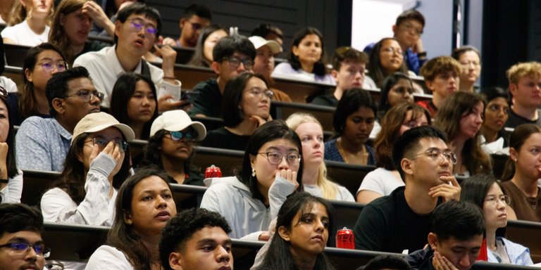 Orientation on Auckland campus. Students in lecture theatre seated for presentation.